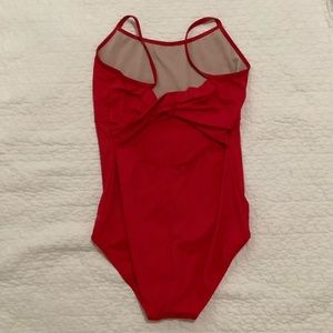 Woman S red ballet leotard. Stretchy and fitted. Has a cross back